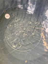 A Chinese monochrome blue Swatow dish with incised carp design, Ming